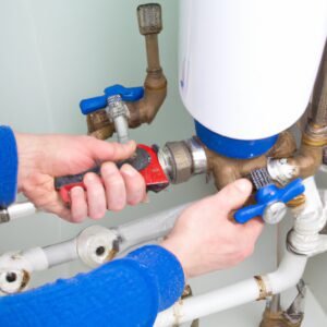 East London plumber working on hot water cylinder
